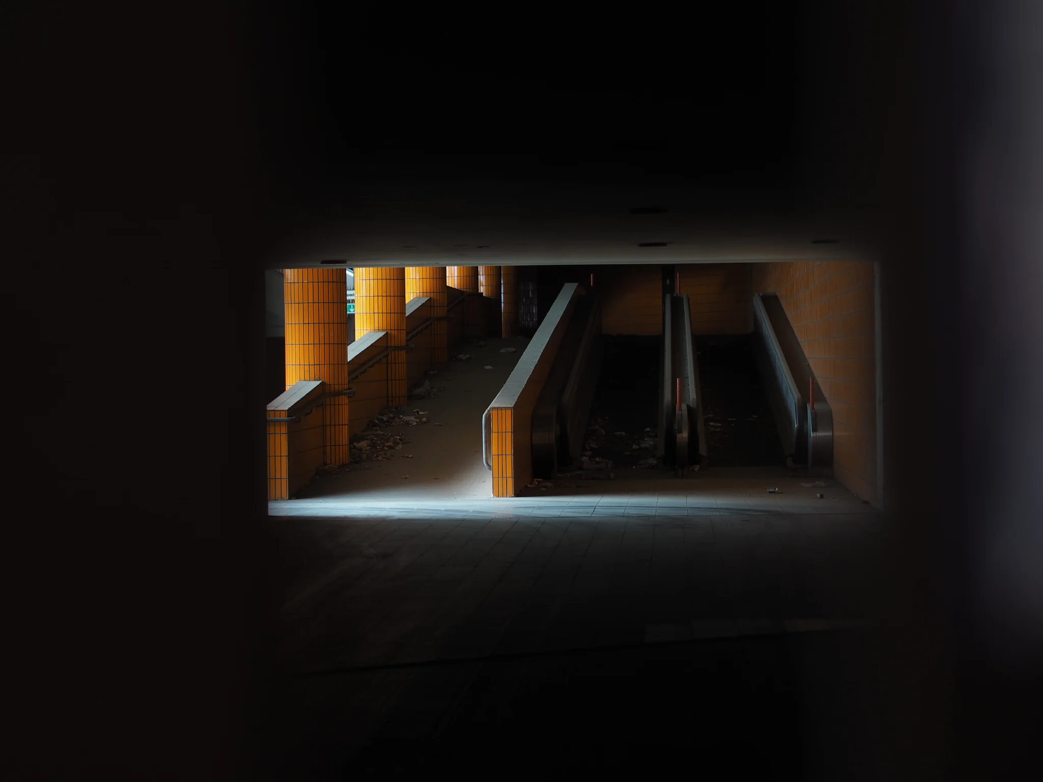 Dark image of desolate subway passage